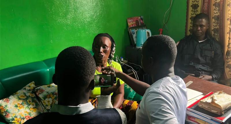Journalists in Conversation with the person believe to be 